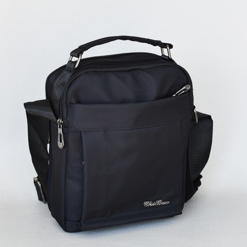 Мъжка чанта от плат за в ръка и през рамо подходяща за носене на пистолет черна